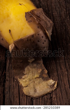 Fresh Hot Boiled Potato with Peeled Skins on Wood Table Background, Concept and Idea of Food Cook Rustic Still life Style. Close up.