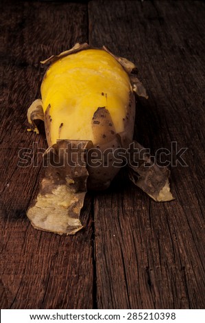 Fresh Hot Boiled Potato with Peeled Skins on Wood Table Background, Concept and Idea of Food Cook Rustic Still life Style. Vertical.