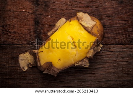 Fresh Hot Boiled Potato with Peeled Skins on Wood Table Background, Concept and Idea of Food Cook Rustic Still life Style.