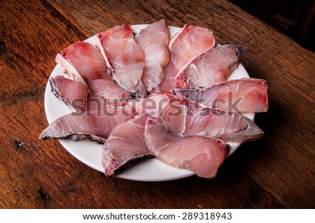 Barramundi, Silver Perch, White Perch, Sea Bass. Fresh Ocean Fish Sliced. Cooking Idea. / on Wood Table Background, Rustic Still Life Style. Full.