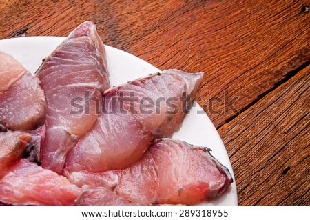 Barramundi, Silver Perch, White Perch, Sea Bass. Fresh Ocean Fish Sliced. Cooking Idea. / on Wood Table Background, Rustic Still Life Style. Close up Selective Focus Shot.