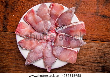 Barramundi, Silver Perch, White Perch, Sea Bass. Fresh Ocean Fish Sliced. Cooking Idea. / on Wood Table Background, Rustic Still Life Style. Top View.