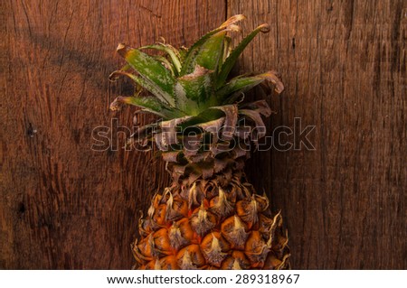 Pineapple, Fresh Organic Harvest Tropical Fruit, on Wood Table Background, Rustic Still Life Style.