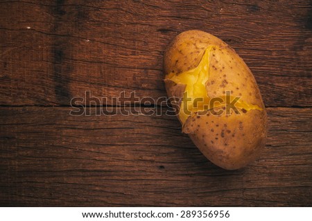 Fresh Hot Boiled Potato Unpeeled Skins Textured on Wood Table Background, Concept and Idea of Food Cook Rustic Still life Style.