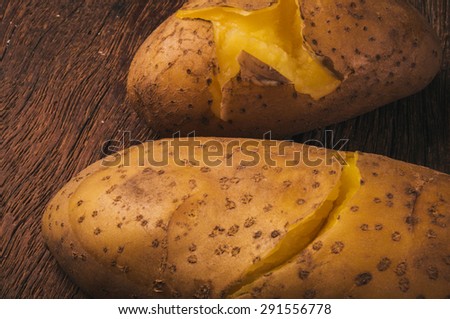Fresh Hot Boiled Potato (Pair, Two) Unpeeled Skins Textured on Wood Table Background, Concept and Idea of Food Cook Rustic Still life Style. Close up.
