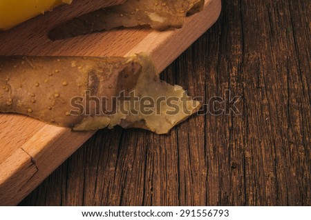 Fresh Hot Boiled Potato Peeled Skins on Wood Cutting Board, Wood Table Background, Concept and Idea of Cooking, Food Rustic Still life Style.