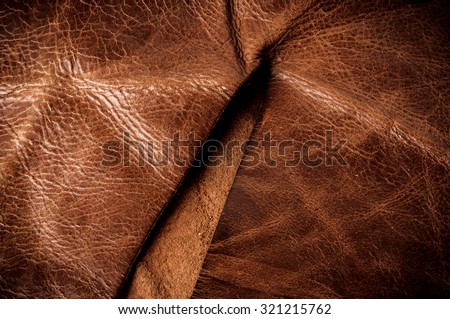 Dark Brown Leather, Genuine. Concept and Idea of Fine Leather Crafting, Handcrafts, Handmade, Handcrafted, Leather Industry. Background Textured and Wallpaper. Rustic Style.