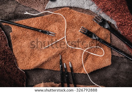 Leather Crafting, Artisan Crafts, Handmade Leather Tools with Wax Cord and Needle. Leather Pieces Workspace, Background Wallpaper and Textured.