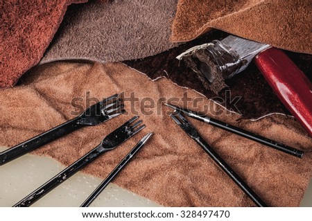 Leather Crafting, Artisan Crafts, Handmade Leather Tools with Hammer. Leather Pieces Workspace, Background Wallpaper and Textured.