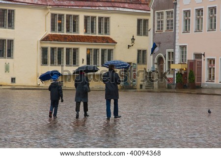 People with umbrellas in Tallinn, Estonia