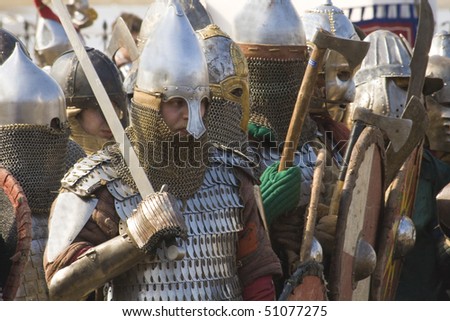 NOVGOROD, RUSSIA - APRIL 11: Members of historical club wears medieval knights armors on folklore festival, April 11, 2010 in Novgorod, Russia