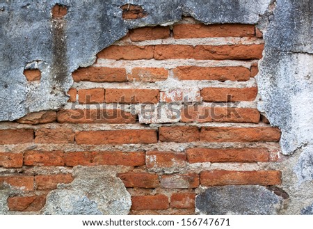 Old red brick walls cracked concrete vintage brick wall background.