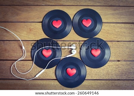 Music Lover - Albums with red love hearts on a wooden surface