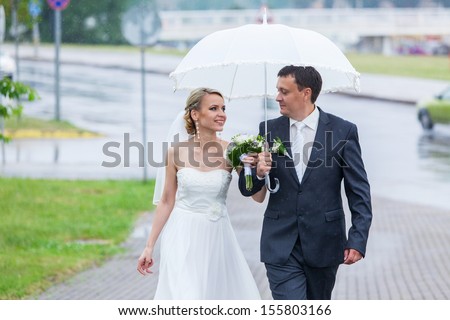 Rain pours on a wedding day