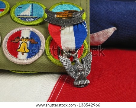 Close up of an Eagle Scout Award sitting on a Flag