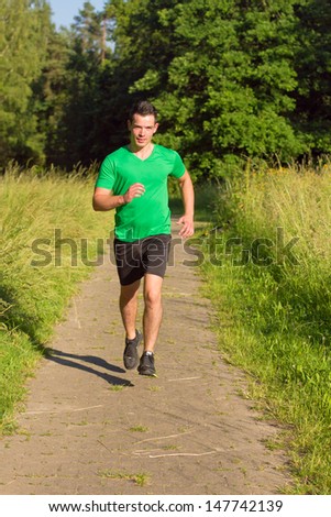 Man jogging on road outdoors