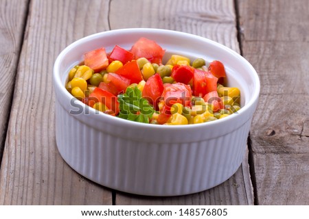 Salad with corn, tomatoes, paprika and pea