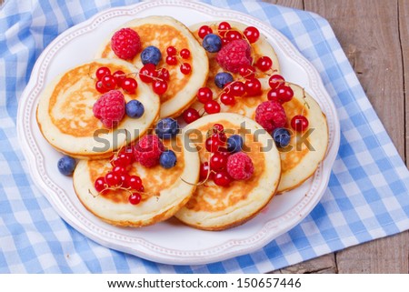 Pancakes with mix berries on a plate