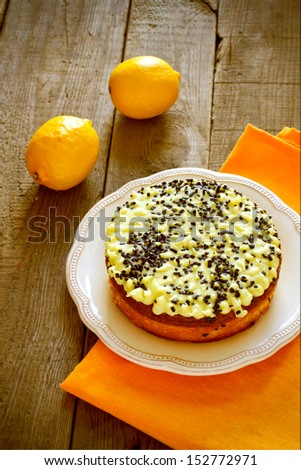 Lemon cake with lemons on a table
