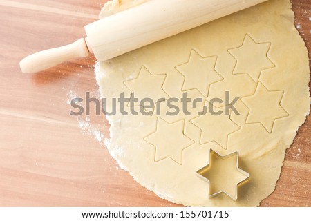 Dough with cutting form preparation for baking christmas cookies