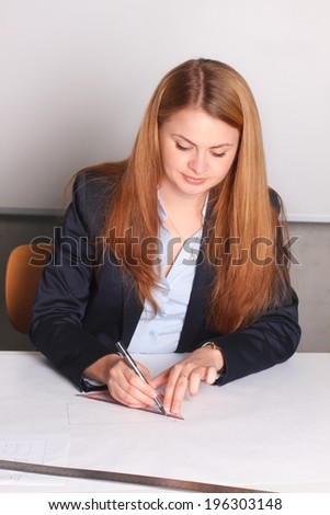Businesswoman in suit drawing