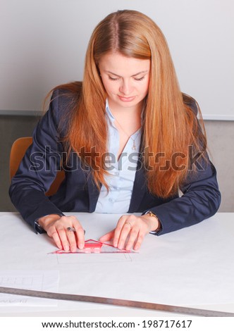 Businesswoman in suit drawing
