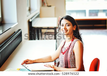 Indian business woman sitting at the table
