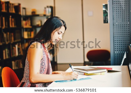 Indian business woman working writing