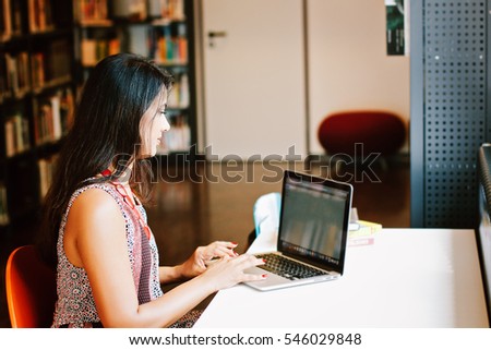 Indian businesswoman working on laptop