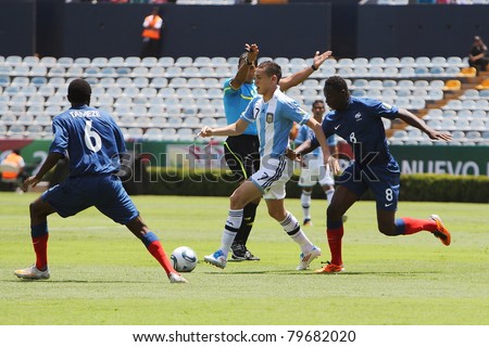 MONTERREY, MEXICO - JUNE 18: French Soualiho Meite (R) chases Argentinian Lucas Ocampos (C)  during FIFA U-17 World Cup Mexico 2011 on June 18, 2011 in Monterrey, Mexico. France won 3 - 0.