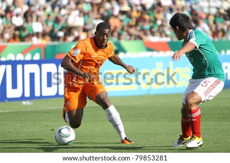 MONTERREY, MEXICO - JUNE 24: Danzell Gravenberch (NED) dribbles against Jorge Caballero (MEX) during FIFA U-17 World Cup Mexico 2011 on June 24, 2011 in Monterrey, Mexico. Mexico won 3 - 2.