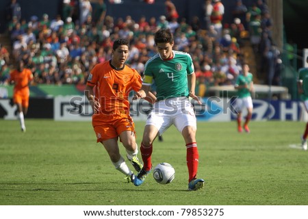 MONTERREY, MEXICO - JUNE 24: Anass Achahbar (NED) chases Antonio Briseno (MEX) during FIFA U-17 World Cup Mexico 2011 on June 24, 2011 in Monterrey, Mexico. Mexico won 3 - 2.