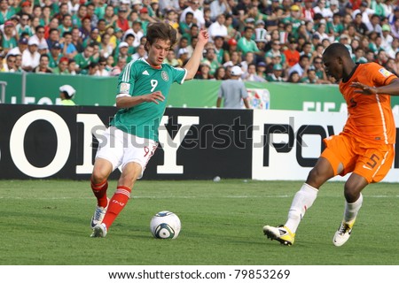 MONTERREY, MEXICO - JUNE 24: Jetro Willems (NED) tries to stop Carlos Fierro (MEX) during FIFA U-17 World Cup Mexico 2011 on June 24, 2011 in Monterrey, Mexico. Mexico won 3 - 2.