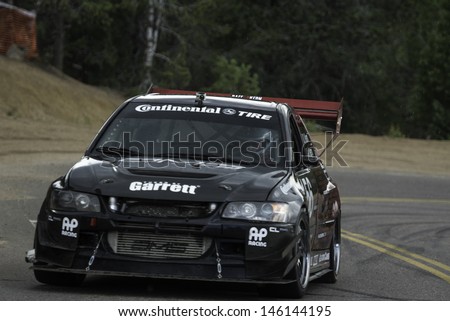 COLORADO SPRINGS, CO - JUNE 30: David Kern #156 drives a 2005 Mitsubishi Lancer Evolution to in the Time Attack Class at the Pikes Peak International Hill Climb on June 30, 2013 in Colorado Springs.