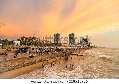 Colombo, Sri Lanka - February 16 2012: A large crowd enjoys the sunset on Galle fort road on the seafront of Colombo, the capital city of Sri Lanka