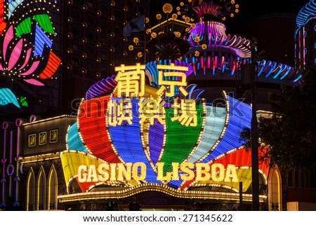 Macau, Macau - April 15 2015: The bright lights of the Casino Lisboa illuminate the night of Macau. The city has surpassed Las Vegas in terms of Casinos revenues.