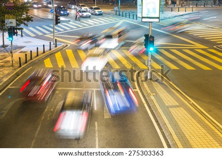 Cars rushing through an intersection in Kuala Lumpur, Malaysia capital city.