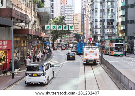 Hong Kong, Hong Kong - April 17 2015: Cars and buses find their way in the crowded traffic around the shopping district of Causeway Bay in Hong Kong island
