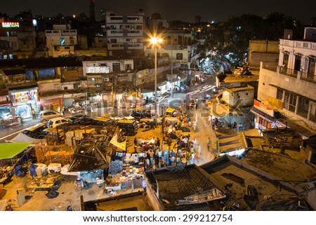 New Delhi, India - September 7 2014: People, captured with blurred motion, walk in the New Delhi bazaar street in India
