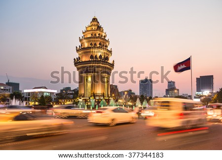 Traffic rush around the Independence monument, with its Khmer architecture style, in Phnom Penh, Cambodia capital city. Blurred motion archived with long exposure.