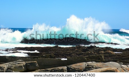 Large waves breaking on the rocks, New Zealand.