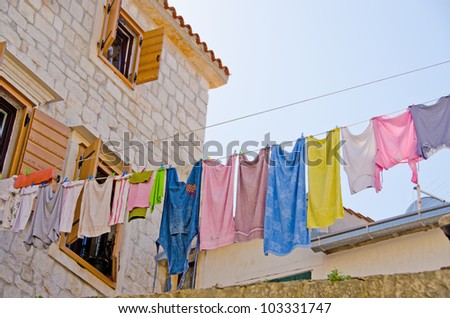Trogir, Croatia - old alley with laundry line