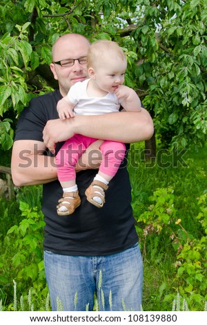 Happy daddy with his one year old baby girl