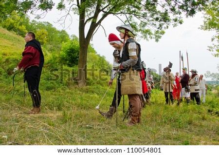 STRONSKO, POLAND - AUG 5: historical reconstruction of attacking a Medieval village during the First Knights Tournament for the prize of Zapolice Mayor,   August 5 2012, Stronsko, Poland