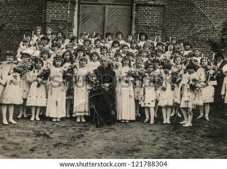 LODZ, POLAND, CIRCA 1934- Vintage photo of group of little girls with a priest - First Communion, Lodz, Poland, circa 1934