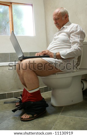 stock-photo-man-working-with-laptop-on-toilet-seat-11130919.jpg