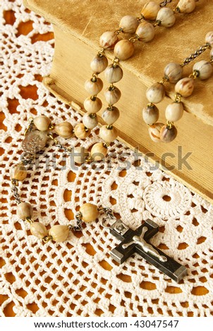 Vintage Bible and rosary beads