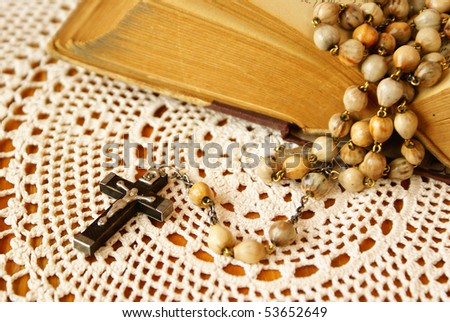 Old bible and rosary beads