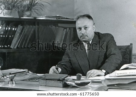 Vintage portrait of man in his office (fifties)