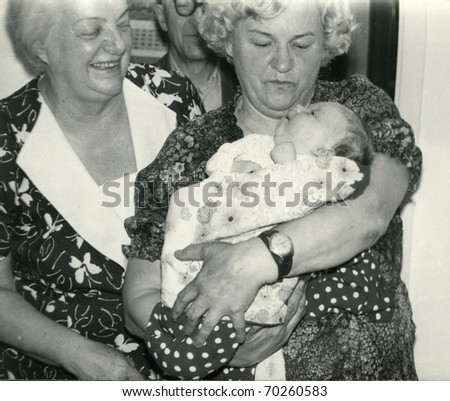 Vintage unretouched photo of two grandmothers, grandfather and baby girl